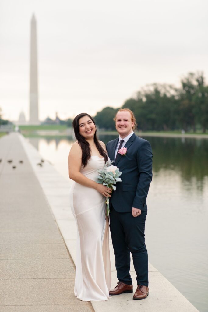 bride and groom, national mall, washington monument, reflecting pool, destination wedding portraits, traveling wedding photographer, bride, wedding portraits, Hobby Lobby artificial flowers, artificial bouquet