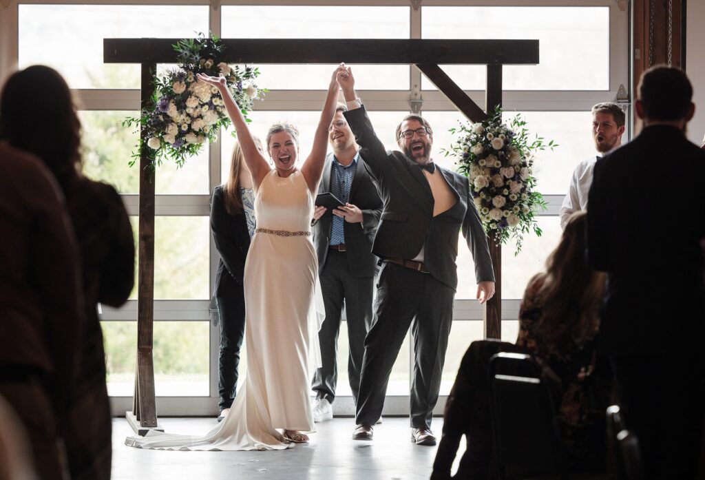floral arbor, newlyweds, joyful new york wedding and answered prayers